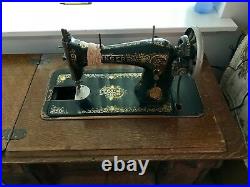 Antique Singer Sewing Machine in Oak Cabinet with sewing machine